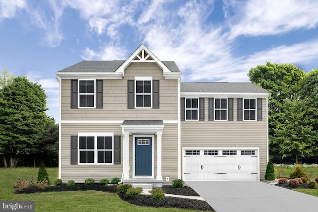 view of front of house with a front yard and a garage