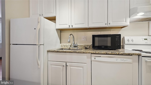 kitchen with light stone countertops, white cabinetry, white appliances, custom exhaust hood, and sink