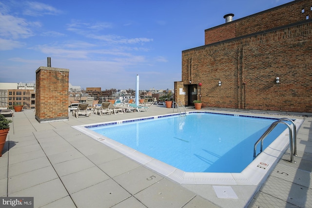 view of pool featuring a patio