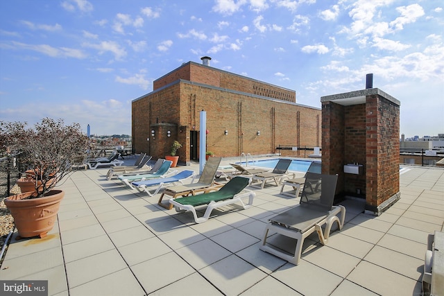 view of patio with a community pool