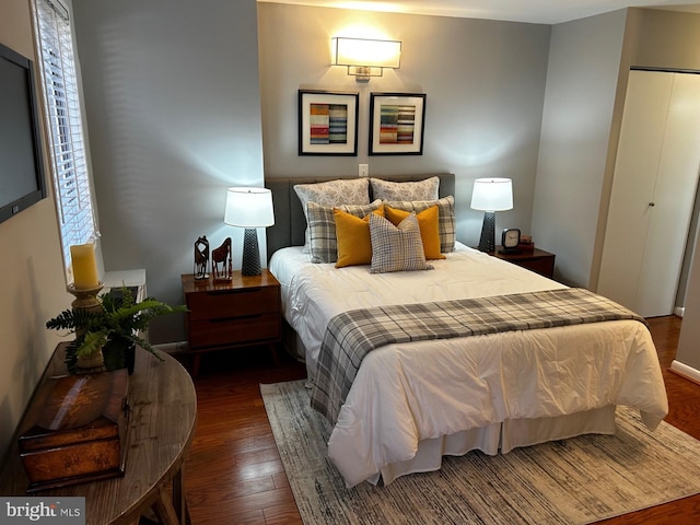 bedroom featuring dark hardwood / wood-style flooring