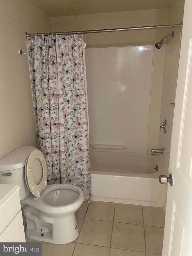 full bathroom with tile flooring, shower / bath combination with curtain, vanity, and toilet