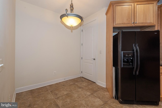 interior space featuring black fridge and light tile floors