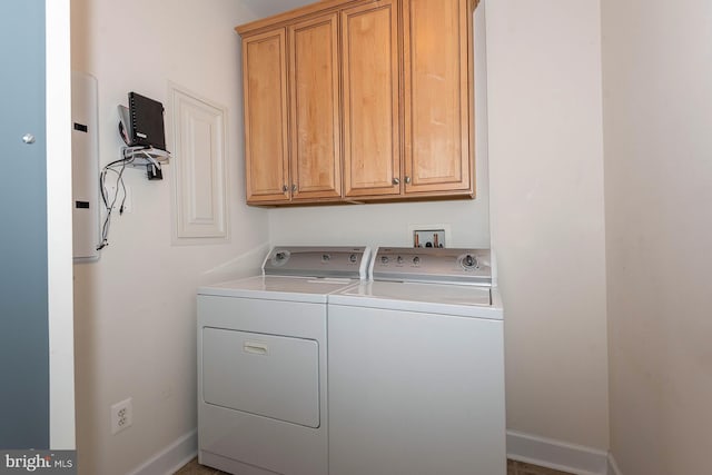 laundry room with washer hookup, cabinets, and washer and dryer