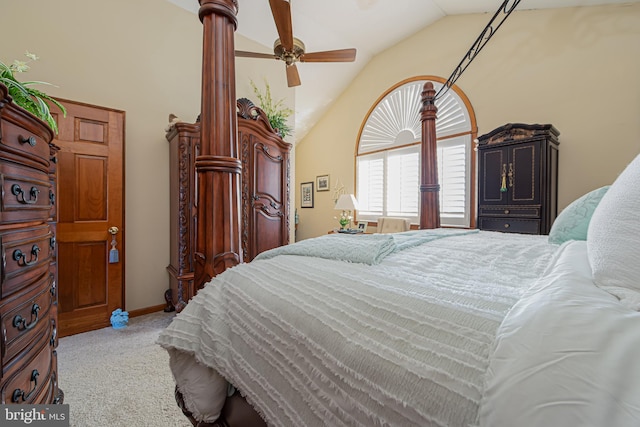 bedroom featuring light colored carpet, vaulted ceiling, and ceiling fan