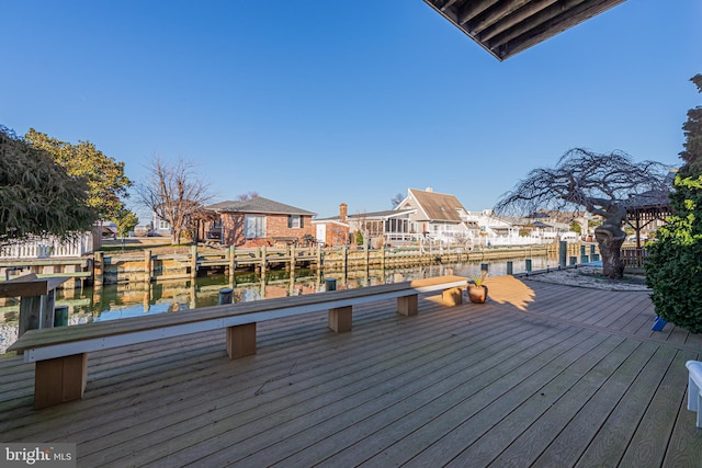 deck with a water view and a boat dock