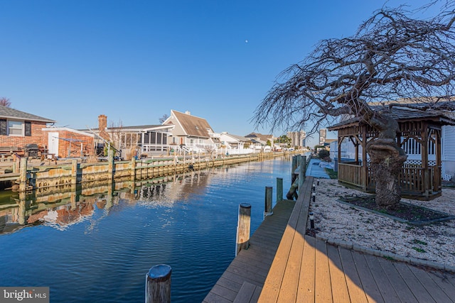 dock area with a water view