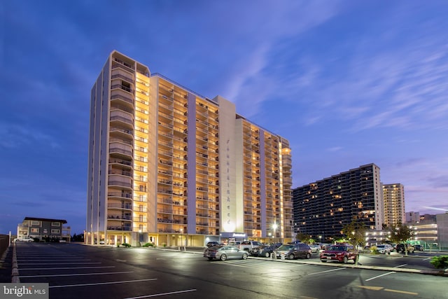 view of outdoor building at dusk