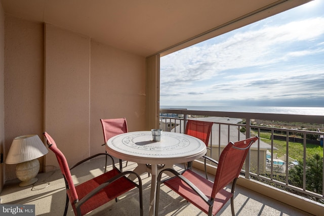 balcony featuring a water view