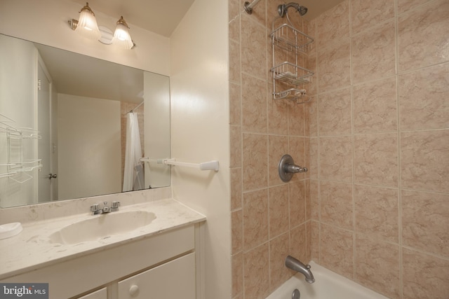 bathroom featuring shower / tub combo with curtain and vanity with extensive cabinet space