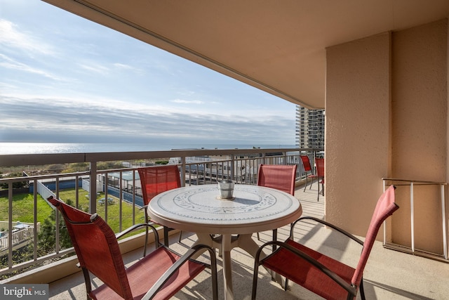 balcony featuring a water view