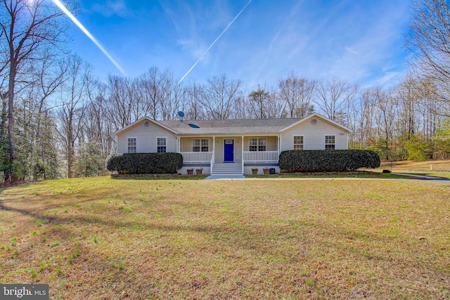 view of front of house featuring covered porch and a front yard