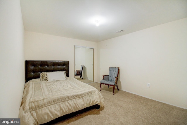 carpeted bedroom with a closet