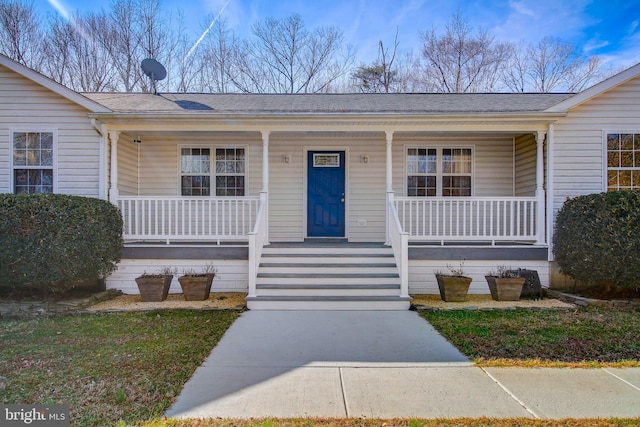 view of front of property featuring covered porch