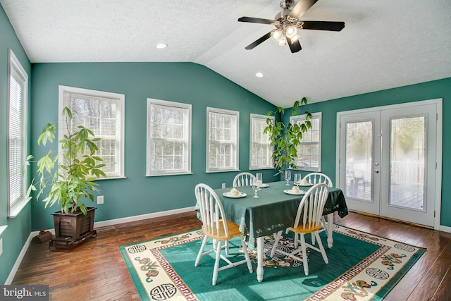 dining space featuring lofted ceiling, ceiling fan, dark wood-type flooring, and french doors