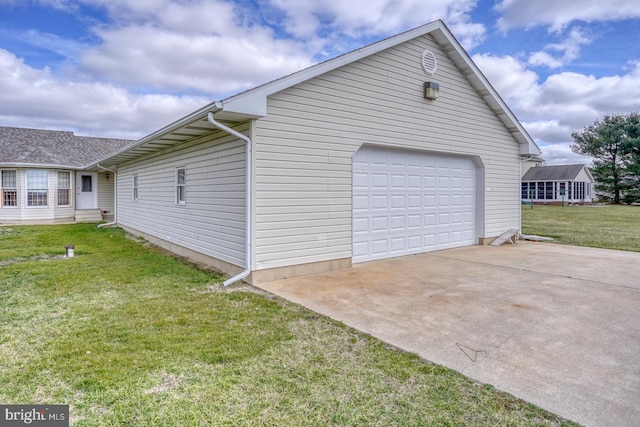 view of side of home featuring a lawn and a garage