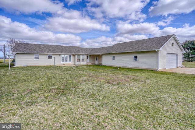 view of front of house featuring a garage and a front lawn