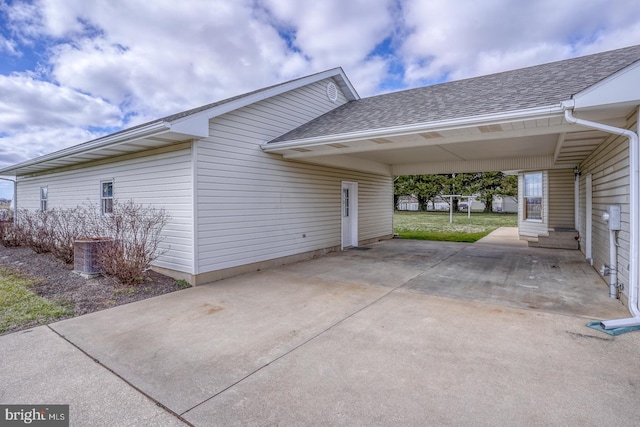 view of side of home featuring a carport