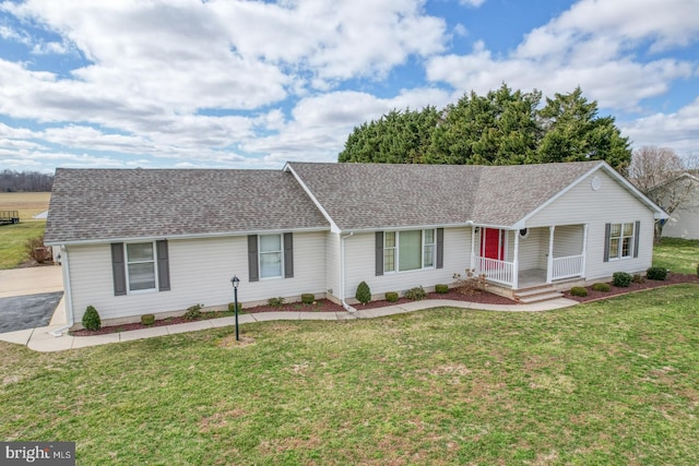 single story home featuring a porch and a front lawn