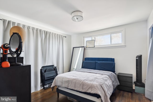 bedroom featuring dark hardwood / wood-style floors