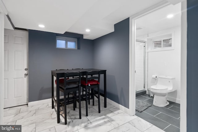 dining space with light tile floors