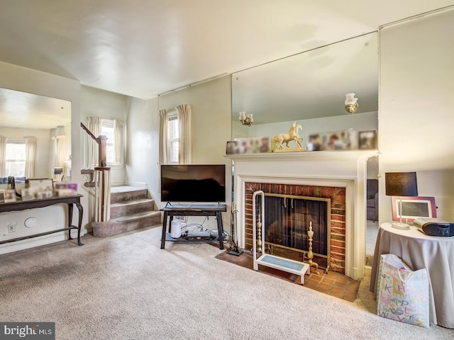 carpeted living room featuring a brick fireplace