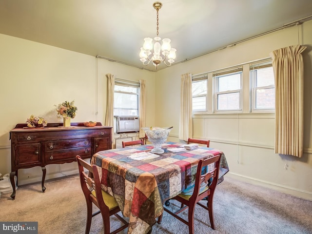 dining space with an inviting chandelier, light colored carpet, and a wealth of natural light