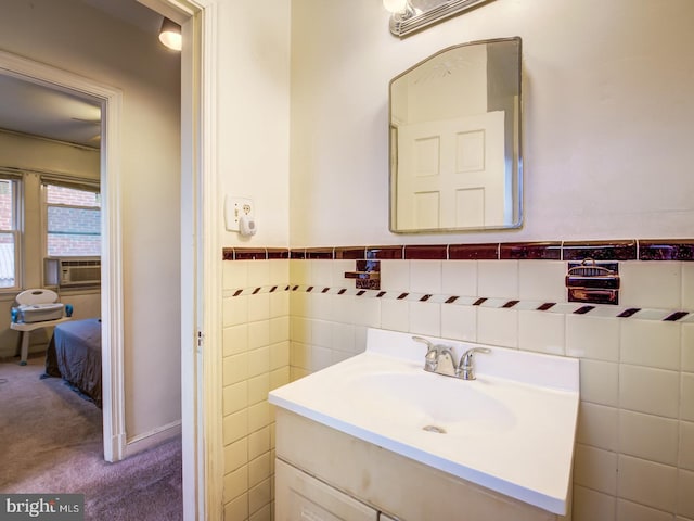 bathroom with tile walls and oversized vanity