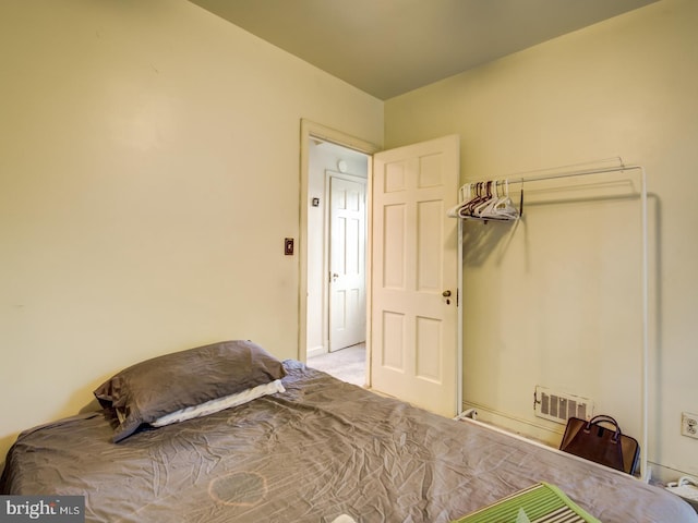 bedroom with light carpet