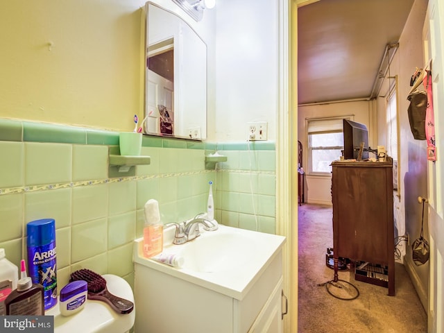 bathroom with backsplash, tile walls, and oversized vanity