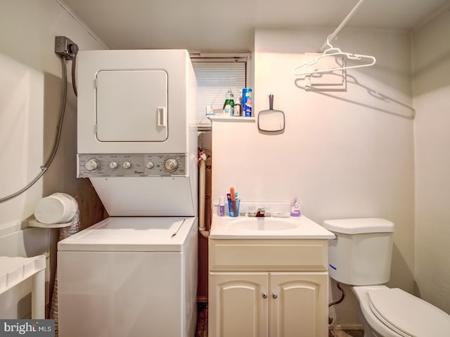 laundry room with ornamental molding, sink, and stacked washer and dryer