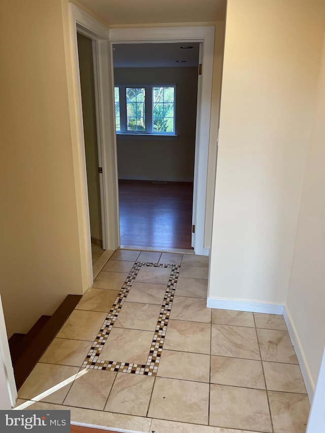 corridor with light tile floors