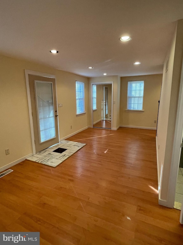 unfurnished room with light hardwood / wood-style floors