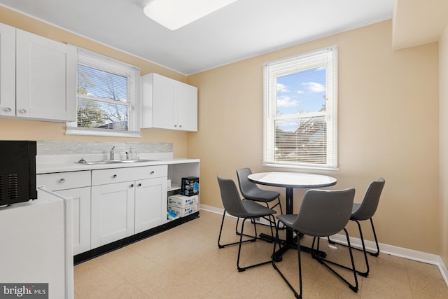 interior space featuring sink and light tile floors