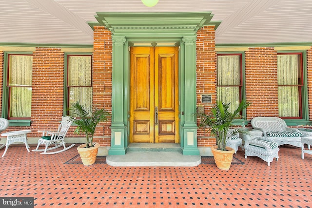 doorway to property featuring covered porch