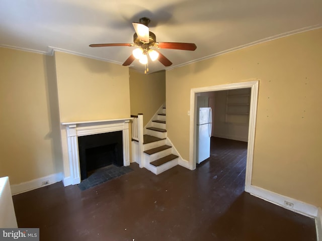 unfurnished living room featuring ceiling fan and crown molding