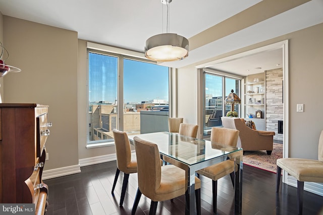 dining area featuring dark hardwood / wood-style flooring and built in features