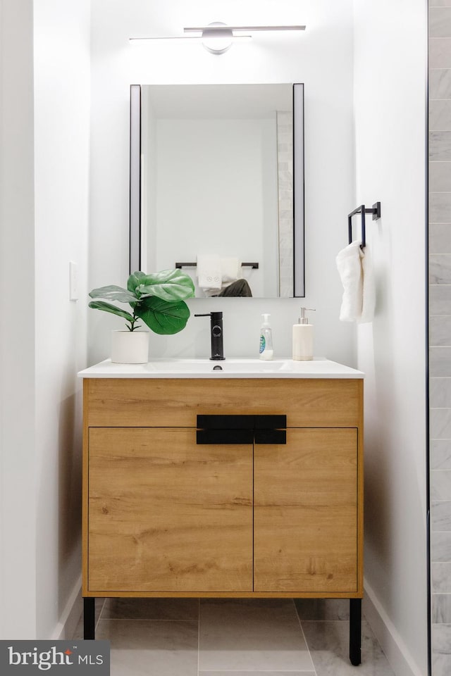 bathroom featuring vanity and tile flooring