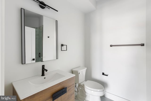 bathroom with toilet and vanity