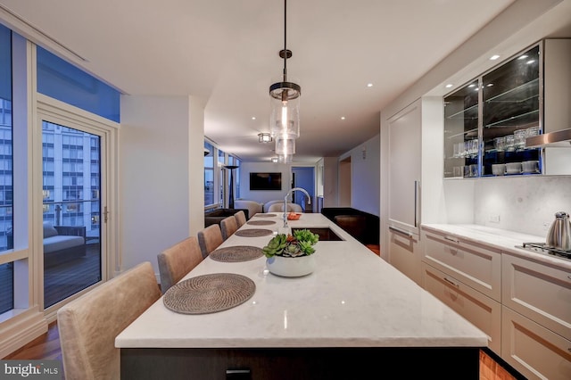 dining room with dark wood-type flooring and sink