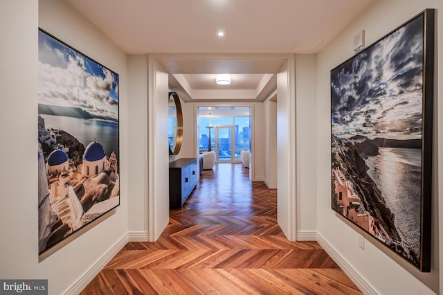 hallway featuring dark parquet flooring