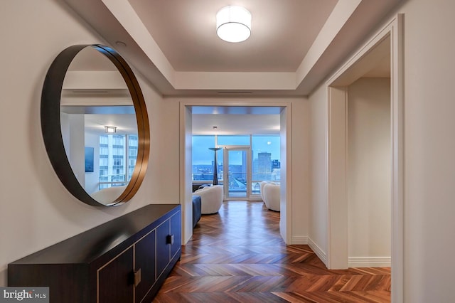 hallway with dark parquet floors