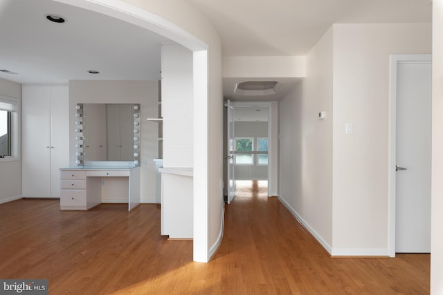 hallway with light hardwood / wood-style flooring