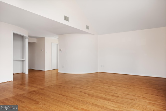 spare room featuring light wood-type flooring