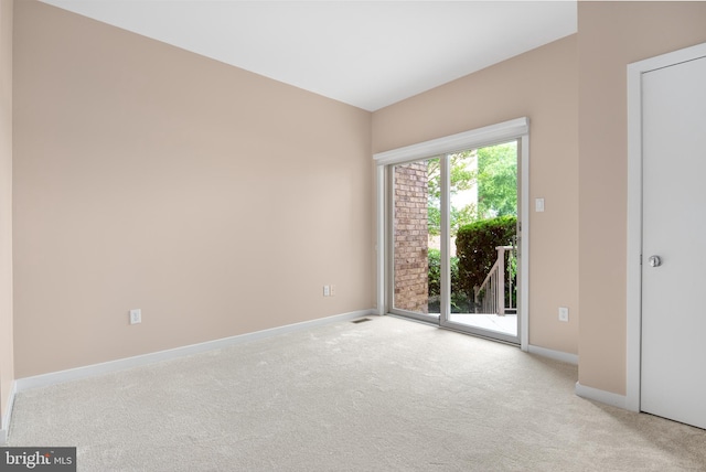 empty room with light colored carpet