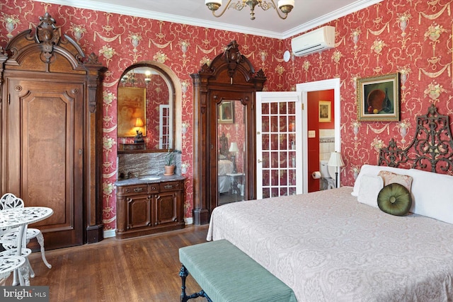 bedroom with a notable chandelier, a wall mounted AC, dark wood-type flooring, and ornamental molding