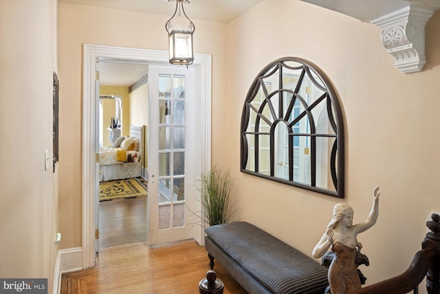 sitting room featuring french doors and light hardwood / wood-style floors