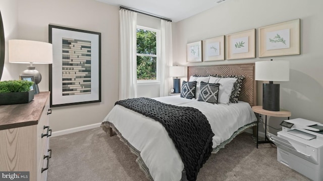 bedroom with light colored carpet