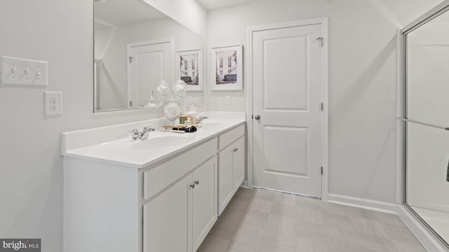 bathroom featuring walk in shower, tile floors, and vanity