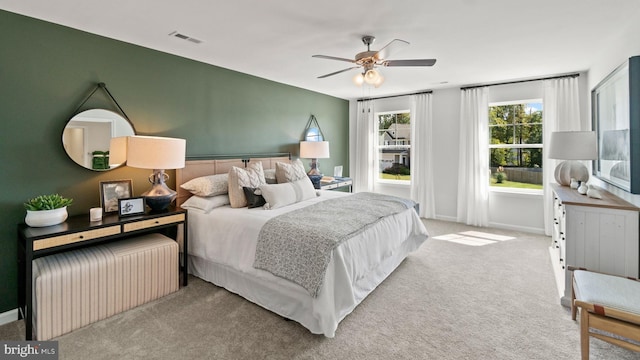 carpeted bedroom featuring ceiling fan